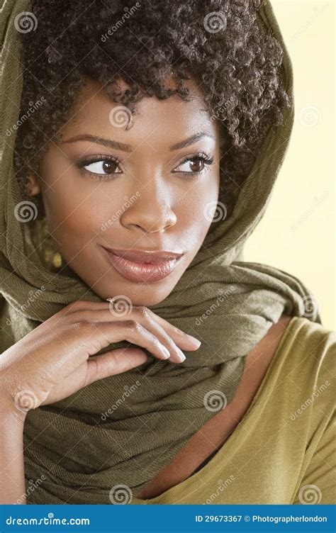 Beautiful African American Woman Looking Away Over Colored Background