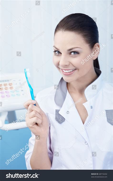 Dentist Holding A Toothbrush Stock Photo 68716432 Shutterstock