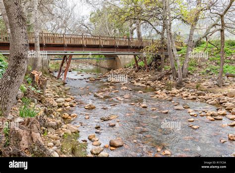 An Historic Steel And Wood Pedestrian Bridge And A Concrete Road Bridge