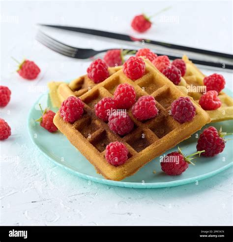 Stack Of Baked Belgian Waffles With Ripe Red Raspberry Stock Photo Alamy