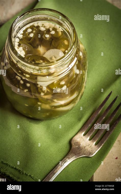 Pickled And Sliced Jalapeno Chilis Capsicum Annuum In A Jar Hi Res