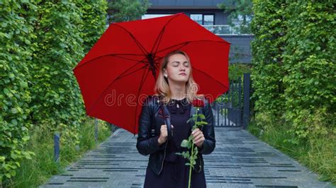 Serious Girl Stands Under Umbrella With Red Rose Stock Video Video Of