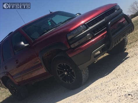 2003 Chevrolet Tahoe With 17x85 25 Mb Wheels Tko And 30565r17 Falken Wildpeak At2 And Leveling