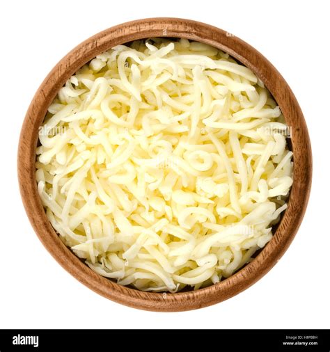 Shredded Mozzarella Pizza Cheese In Wooden Bowl Over White Cheddar