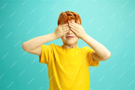 Premium Photo Irish Race Little Boy With Curly Red Hair Covering His