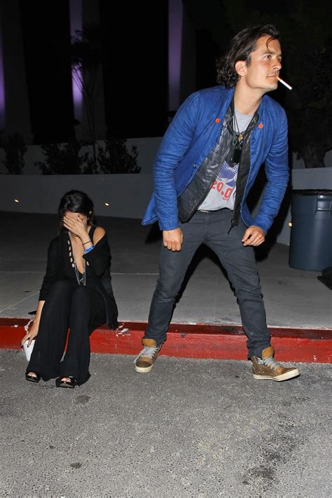 Selena Gomez and Orlando Bloom Outside LA Forum - April 2014 • CelebMafia
