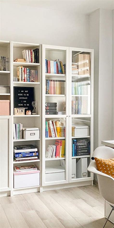 Minimalist White Living Room With Stylish Bookshelves