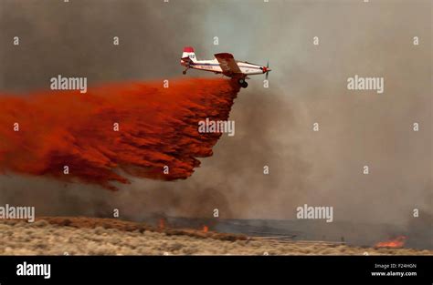 A Piper Pawnee Air Tanker Drops Fire Retardant On The Barry Point Fire Burning In The Fremont