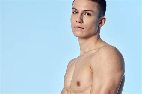 Premium Photo Portrait Of Shirtless Man Against Blue Background