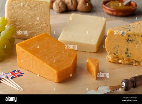 Pieces of traditional english cheese on a cheese board Stock Photo - Alamy