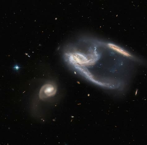 Nasa S Hubble Delivers Stunning View Of Three Galaxies In A Single Image Mashable