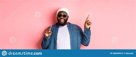 Happy Bearded African American Man Showing Announcement Pointing