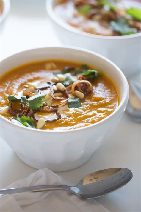 Carrot Ginger Soup With Crispy Shallots And Coconut Cream