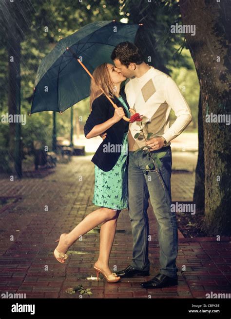 Couple Rain Kiss High Resolution Stock Photography and Images - Alamy