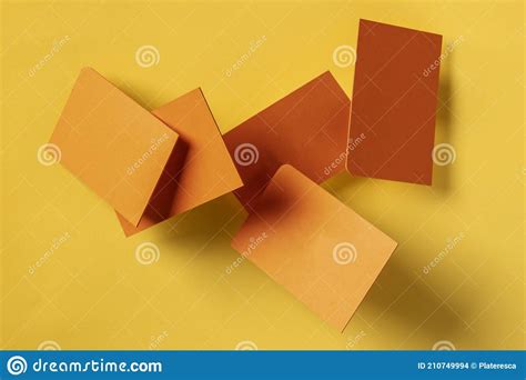 Thick Orange Business Cards With A Rounded Corner Flying Stock Photo