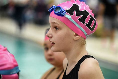 Midland Dolphins Wear Pink Swim Caps To Support Coach Battling Cancer