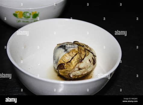 Fetal Duck Egg Balut In A White Bowl Vietnamese Cuisine Stock Photo