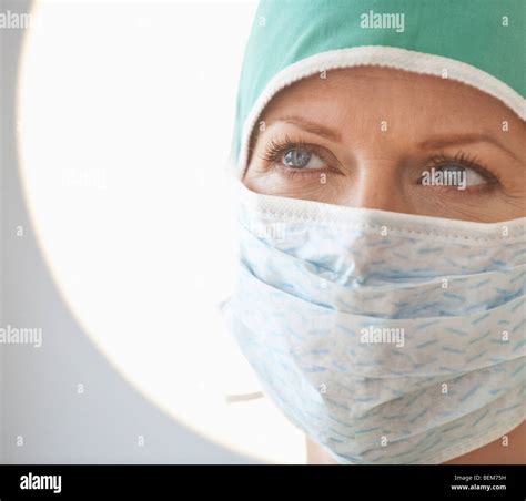 Female doctor with surgical mask Stock Photo - Alamy