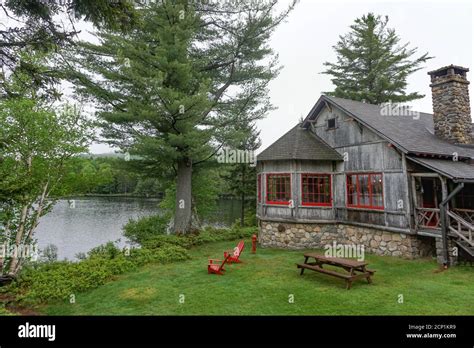 Sagamore Lake, NY: Adirondacks chairs and a picnic table on the lawn at ...