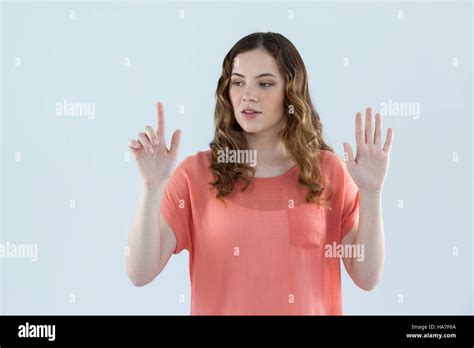 Woman Pretending To Touch An Invisible Screen Stock Photo Alamy