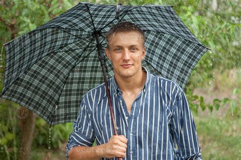 Man with umbrella in rain 10391097 Stock Photo at Vecteezy