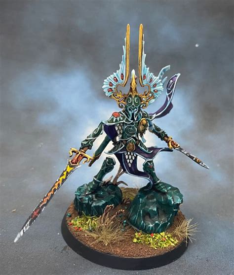 A Painted Warhammer Standing On Top Of A Rock