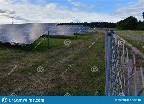 Ground Mounted Solar Panels Generate Electricity On A Cloudy Day Stock