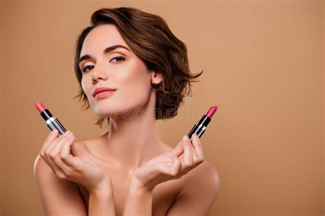 Photo Of Tempting Seductive Woman Naked Shoulders Choosing Pomade Empty Space Isolated Brown