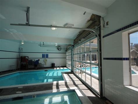 Indoor Swimming Pool Transformed With Glass Doors Indoor Outdoor Pool Indoor Pool Design