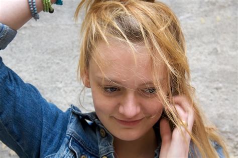 Premium Photo High Angle View Of Smiling Teenage Girl On Road