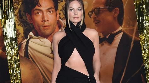 Margot Robbie looks glam in black dress at premiere of racy new film ...