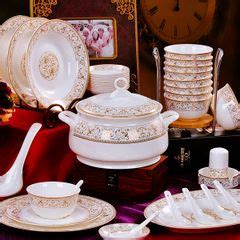 A Table Topped With Lots Of White Dishes