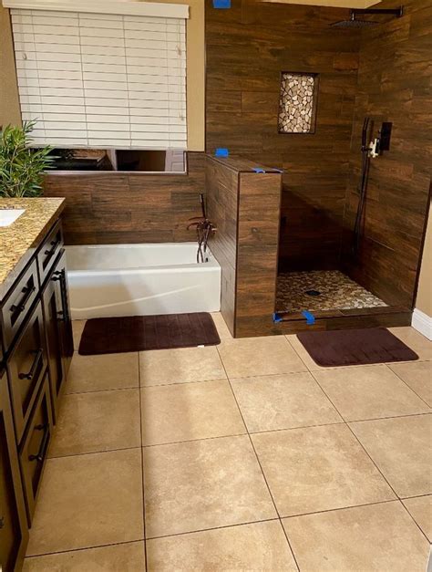 Brown Bathroom Tile Installation | Bathroom tile installation, Brown bathroom tile, Tile ...