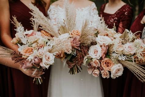 The Bridesmaids Are Holding Their Bouquets With Dried Grasses And