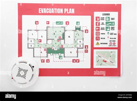 Evacuation Plan And Smoke Detector On White Background Stock Photo Alamy