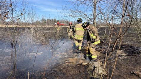 Firefighters Contend With Strong Winds While Battling Large Brush Fire