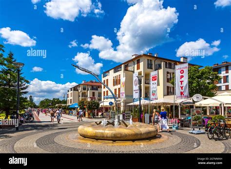 Swinoujscie, Poland - July 2019: People walking across Promenade street in Swinoujscie. Most ...