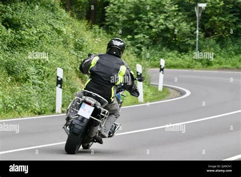 Biker On Motorcycle In A Curve Stock Photo Alamy