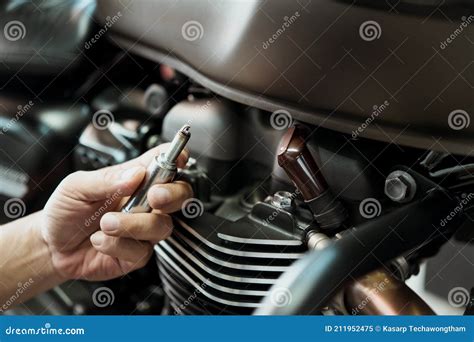 Mechanic Check Motorcycle Spark Plug And Maintenance Inspection Prior