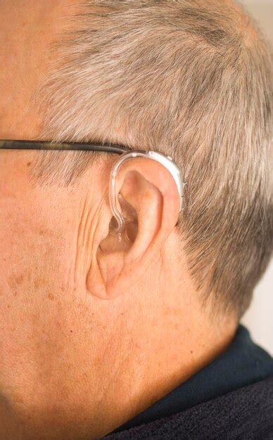 Premium Photo Close Up Of Man Wearing Hearing Aid