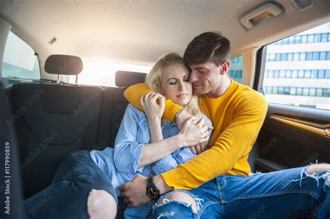 Couple In Love Cuddling On Back Seat Of A Car Stock Photo Adobe Stock