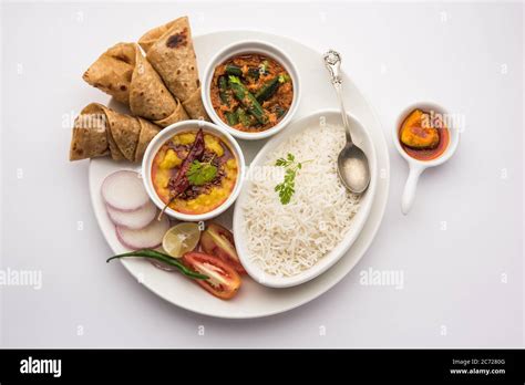 Indian Food Platter Or Vegetarian Thali Includes Dal Fry Rice Chapati