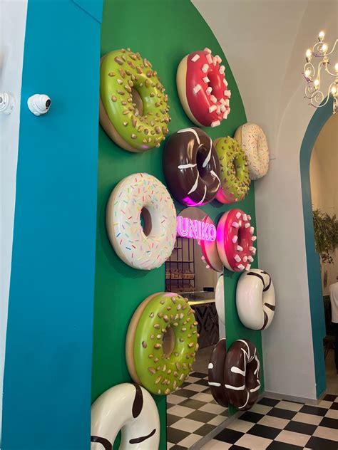 Donut wall in 2024 | Cake shop design, Donut shop coffee, Donut store