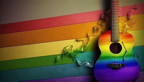 Premium Photo | A rainbow colored guitar is in front of a rainbow ...