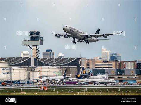 Lufthansa Airbus A340 Taking Off On The Centre Runway Skyline Of