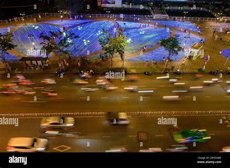 Bright Lights Aerial View Of Nightlife And Moving Traffic By Saigon