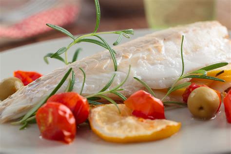 Filetti Di Branzino Al Forno Con Olive Bianche E Pomodori Grand Chef