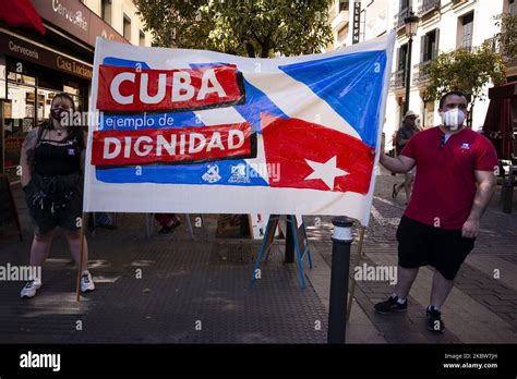 Protesters With Cuban Flags During The Demonstration With The Slogan