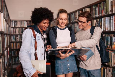 University Students Studying Together In Library Stock Photo 131086