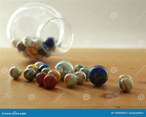 Colourful Marbles On A Wooden Table Top Close Up Stock Photo Image Of